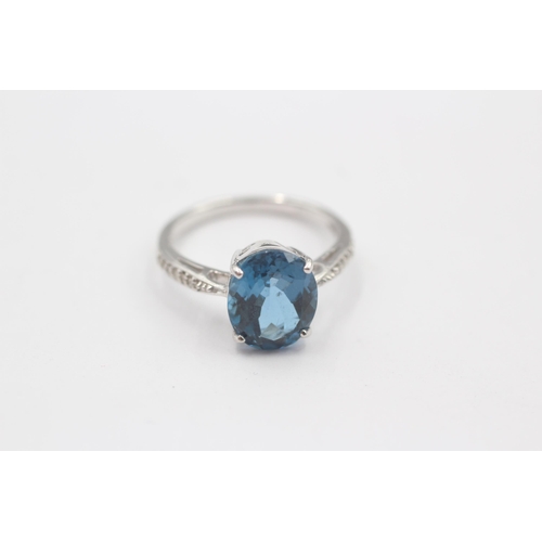 66 - 9ct White Gold Blue Topaz Single Stone Ring With Diamond Set Shank (3.3g) Size  N