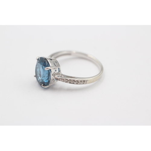 66 - 9ct White Gold Blue Topaz Single Stone Ring With Diamond Set Shank (3.3g) Size  N