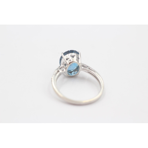 66 - 9ct White Gold Blue Topaz Single Stone Ring With Diamond Set Shank (3.3g) Size  N