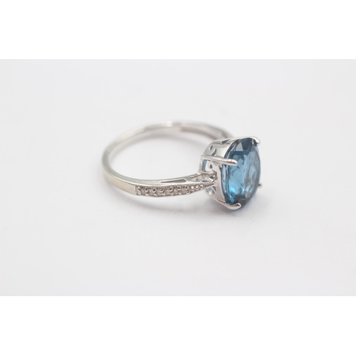 66 - 9ct White Gold Blue Topaz Single Stone Ring With Diamond Set Shank (3.3g) Size  N