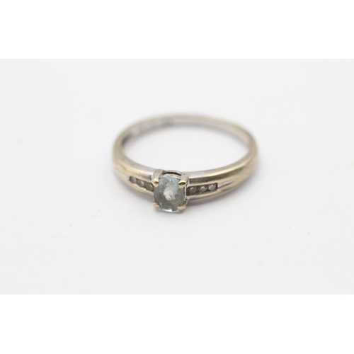 67 - 9ct White Gold Blue Topaz Single Stone Ring With Diamond Sizes (2.1g) Size  O