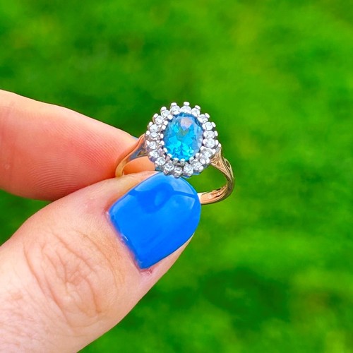56 - 9ct Gold Diamond & Blue Topaz Oval Halo Ring (3g) Size L