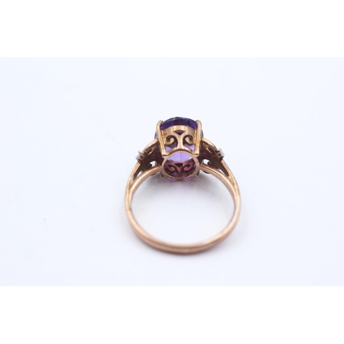 158 - 9ct Gold Amethyst Single Stone Ring With White Gemstone Sides (3.4g) Size  O
