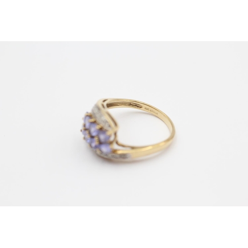46 - 9ct Gold Diamond & Tanzanite Twisted Dress Ring (3.2g) Size  O 1/2