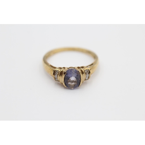 49 - 9ct Gold Iolite Single Stone Ring With Diamond Sides (2.5g) Size  P 1/2