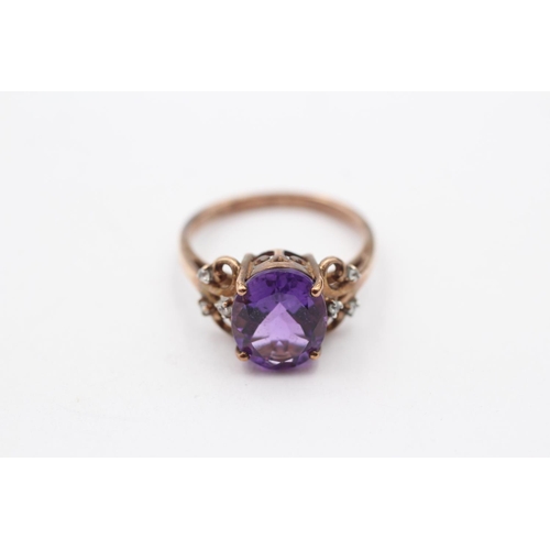 158 - 9ct Gold Amethyst Single Stone Ring With White Gemstone Sides (3.4g) Size  O