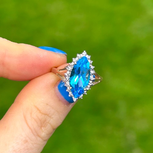 9 - 9ct Gold Blue Topaz Single Stone Ring With Diamond Surround (3g) Size  N
