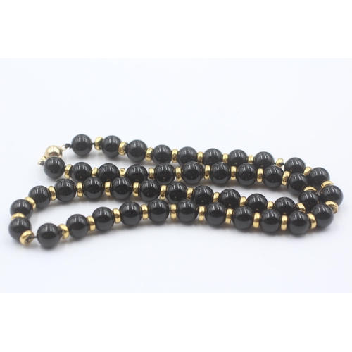 101 - 9ct Gold Onyx Single Strand Necklace (37.8g)