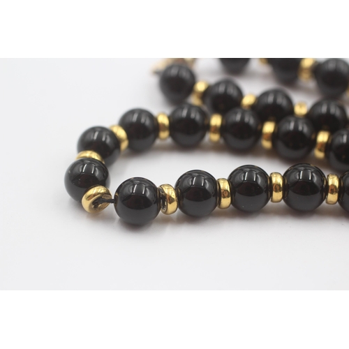 101 - 9ct Gold Onyx Single Strand Necklace (37.8g)