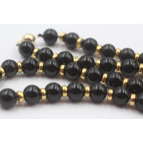 101 - 9ct Gold Onyx Single Strand Necklace (37.8g)