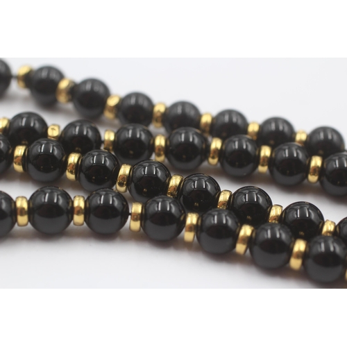 101 - 9ct Gold Onyx Single Strand Necklace (37.8g)