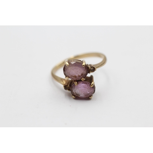 113 - 9ct Gold Amethyst Two Stone Bypass Ring (2.8g) Size  N