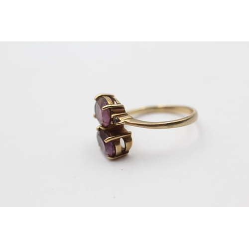 113 - 9ct Gold Amethyst Two Stone Bypass Ring (2.8g) Size  N