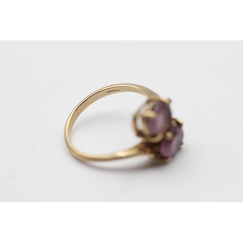 113 - 9ct Gold Amethyst Two Stone Bypass Ring (2.8g) Size  N