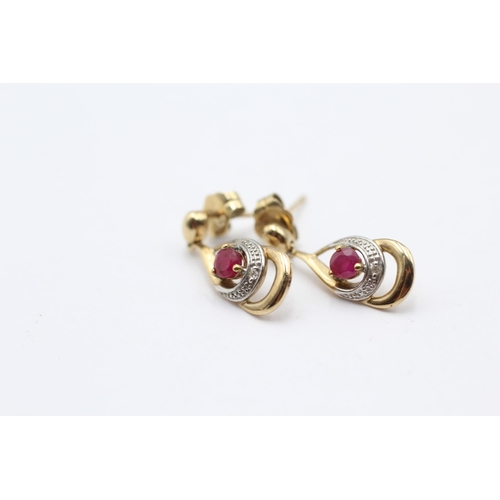 129 - 2 X 9ct Gold Diamond & Ruby Earrings (2g)