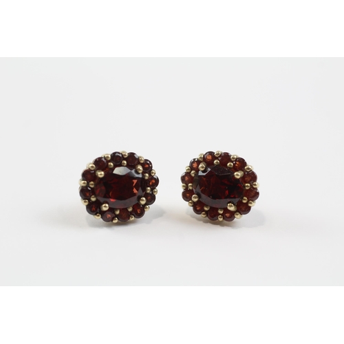 94 - 9ct Gold Garnet Oval Halo Stud Earrings (4.6g)