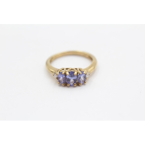 100 - 9ct Gold Diamond Accented Tanzanite Set Trilogy Ring (2.3g) Size  L