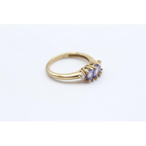 100 - 9ct Gold Diamond Accented Tanzanite Set Trilogy Ring (2.3g) Size  L