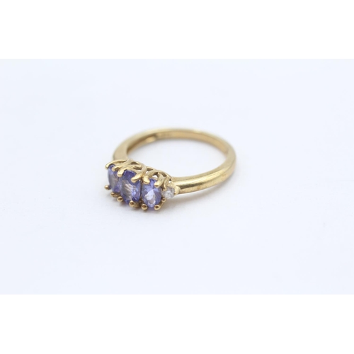 100 - 9ct Gold Diamond Accented Tanzanite Set Trilogy Ring (2.3g) Size  L