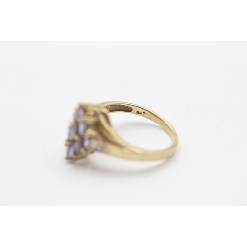 104 - 9ct Gold Diamond Accented Tanzanite Set Marquise Shaped Ring (2.4g) Size  L