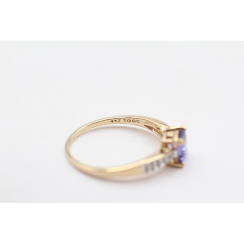 126 - 9ct Gold Cushion Cut Tanzanite, Diamond Accented Shouldered Ring (1.9g) Size  P