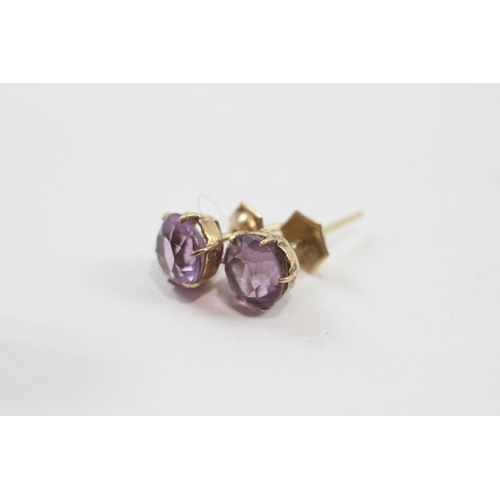 134 - 2 X 9ct Gold Paired Gemstone Earrings Inc. Peridot & Amethyst (2.9g)