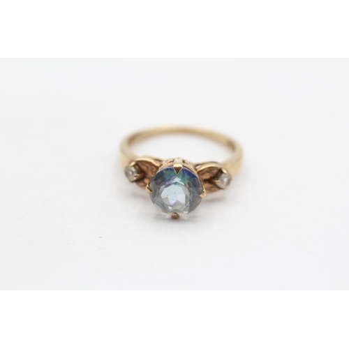 61 - 9ct Gold Blue Coated Topaz And White Topaz Set Trilogy Ring (2.6g) Size  N