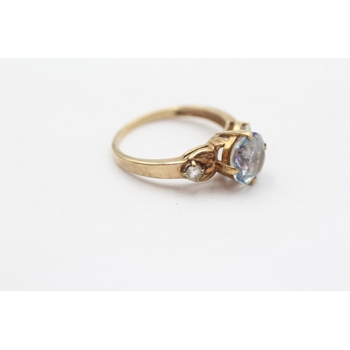 61 - 9ct Gold Blue Coated Topaz And White Topaz Set Trilogy Ring (2.6g) Size  N