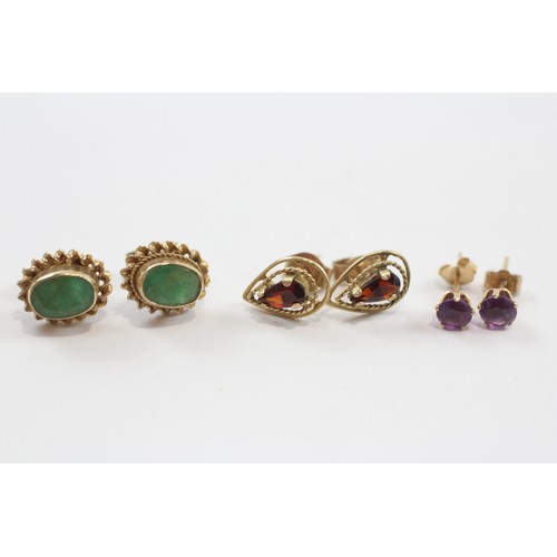 24 - 3 X 9ct Gold Emerald, Amethyst And Garnet Set Stud Earrings (2.5g)