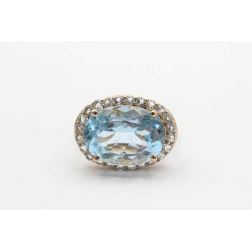 114 - 9ct Gold Blue Topaz Halo Cocktail Ring (5.2g) Size  K