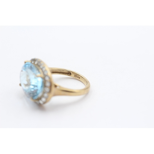 114 - 9ct Gold Blue Topaz Halo Cocktail Ring (5.2g) Size  K