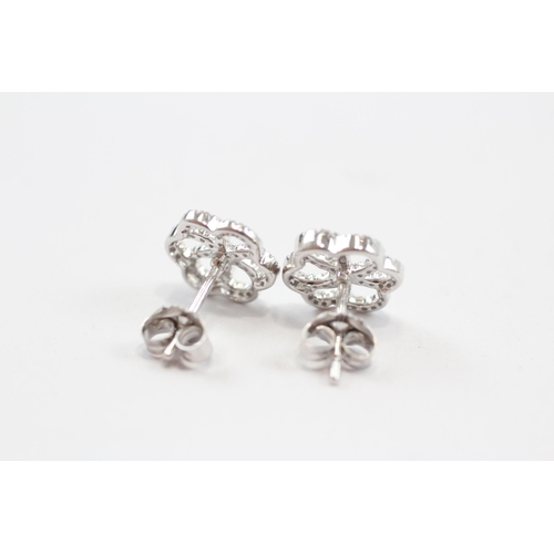 126 - 9ct White Gold Diamond Set Floral Stud Earrings (1.6g)