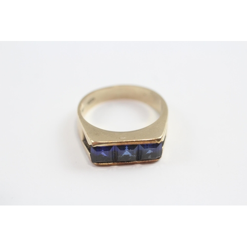 141 - 9ct Gold Synthetic Sapphire Channel Setting Ring (4.9g) Size  N