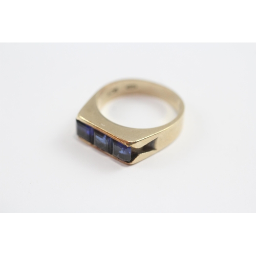 141 - 9ct Gold Synthetic Sapphire Channel Setting Ring (4.9g) Size  N