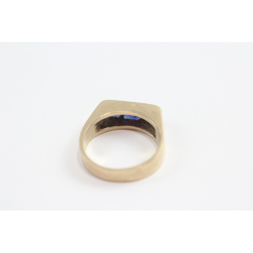 141 - 9ct Gold Synthetic Sapphire Channel Setting Ring (4.9g) Size  N