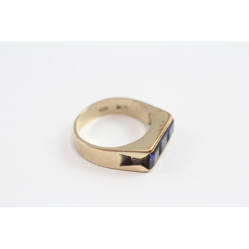 141 - 9ct Gold Synthetic Sapphire Channel Setting Ring (4.9g) Size  N