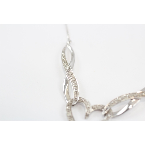 38 - 9ct White Gold Diamond Set Static Knot Pendant Necklace (2.9g)