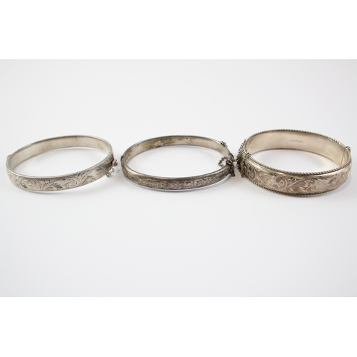 199 - A Collection Of Silver Bangles With Engraved Designs