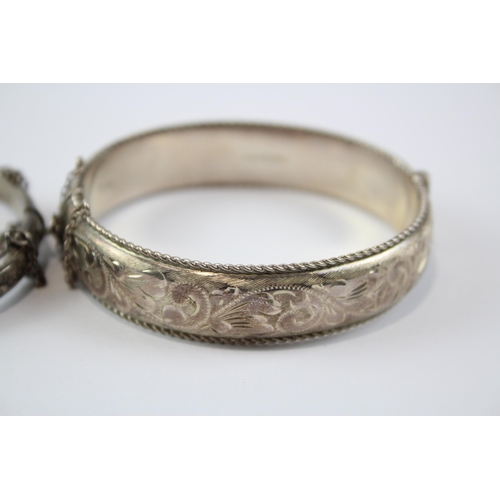 199 - A Collection Of Silver Bangles With Engraved Designs