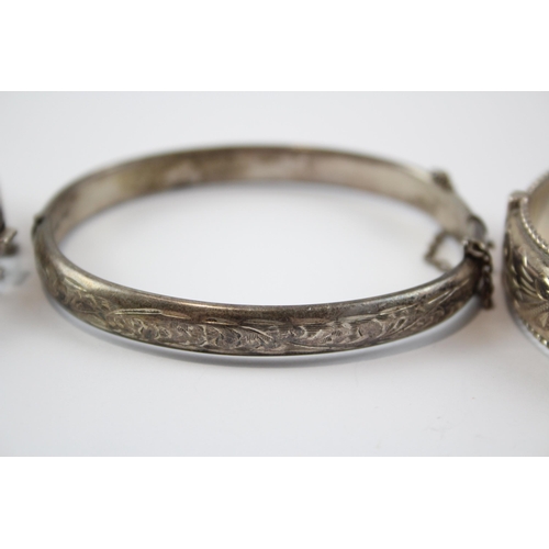 199 - A Collection Of Silver Bangles With Engraved Designs