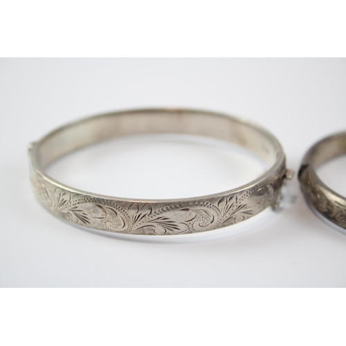 199 - A Collection Of Silver Bangles With Engraved Designs