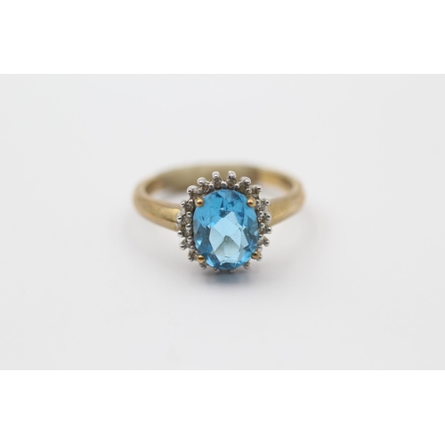 104 - 9ct Gold Diamond & Blue Topaz Oval Cluster Ring (3.4g) Size  O