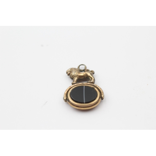 131 - 8ct Gold Onyx & Gate Lion Spinning Fob (3.8g)