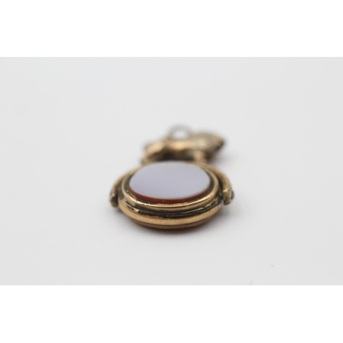 131 - 8ct Gold Onyx & Gate Lion Spinning Fob (3.8g)