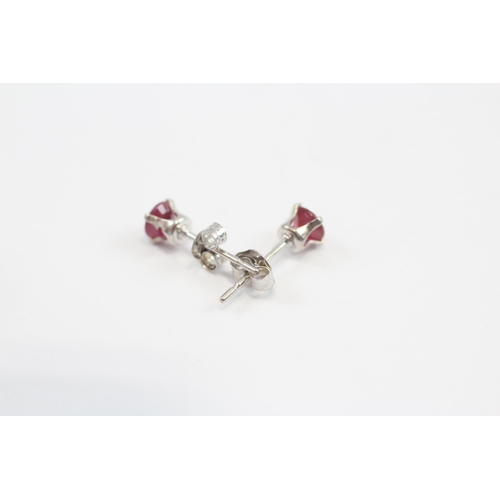 14 - 14ct White Gold Ruby Stud Earrings (0.4g)