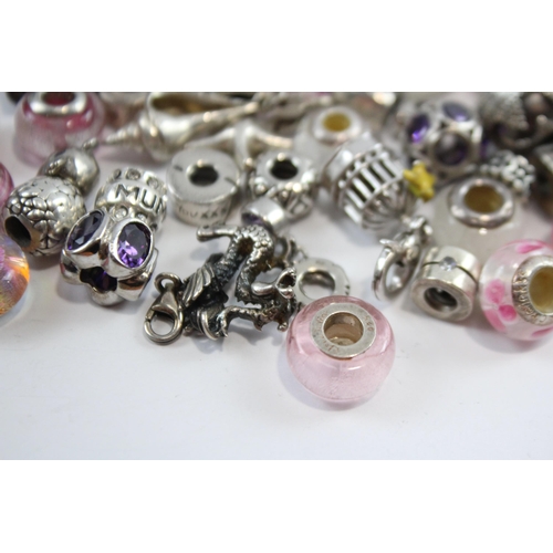 181 - A Collection Of Silver Branded Charms