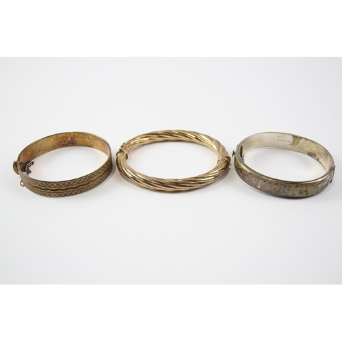 218 - A Collection Of Gold On Silver Bangles