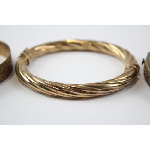 218 - A Collection Of Gold On Silver Bangles