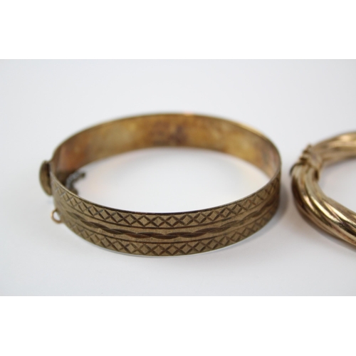 218 - A Collection Of Gold On Silver Bangles