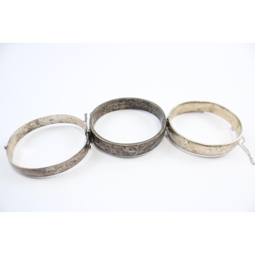 237 - A Collection Of Silver Bangles With Engraved Designs